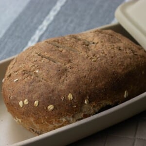 whole wheat bread in covered bread pan