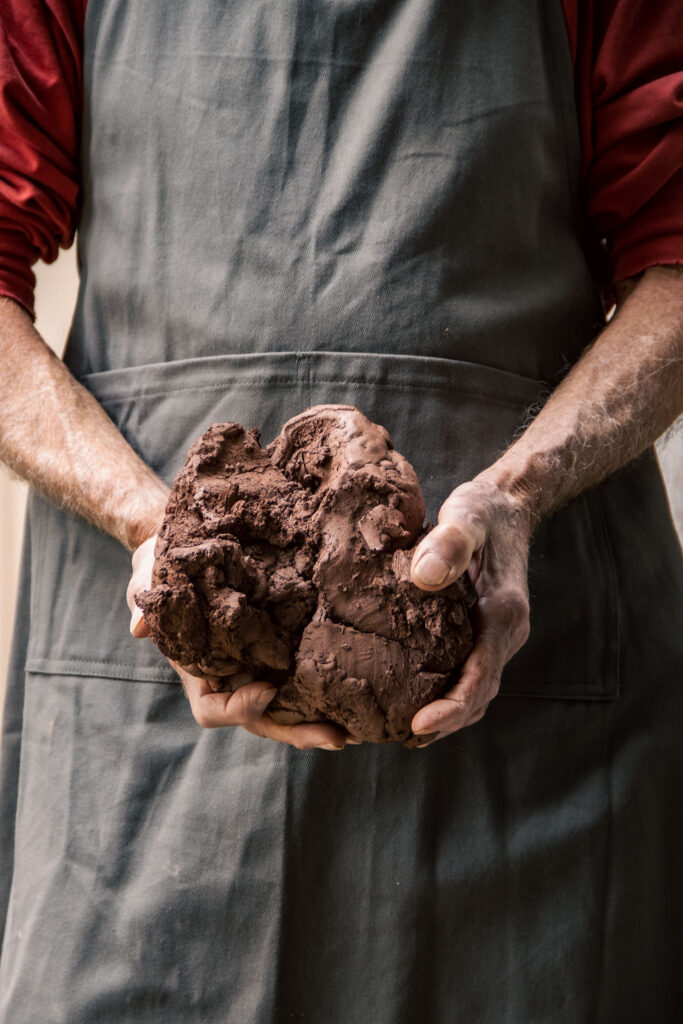 Hands Holding Raw Clay