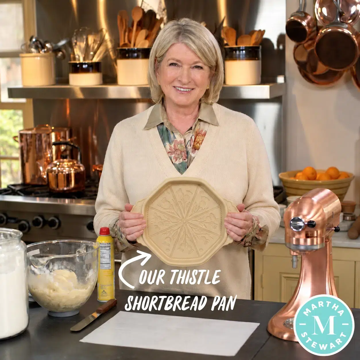 Martha Stewart in her kitchen holding an Emerson Creek Pottery Thistle shortbread pan